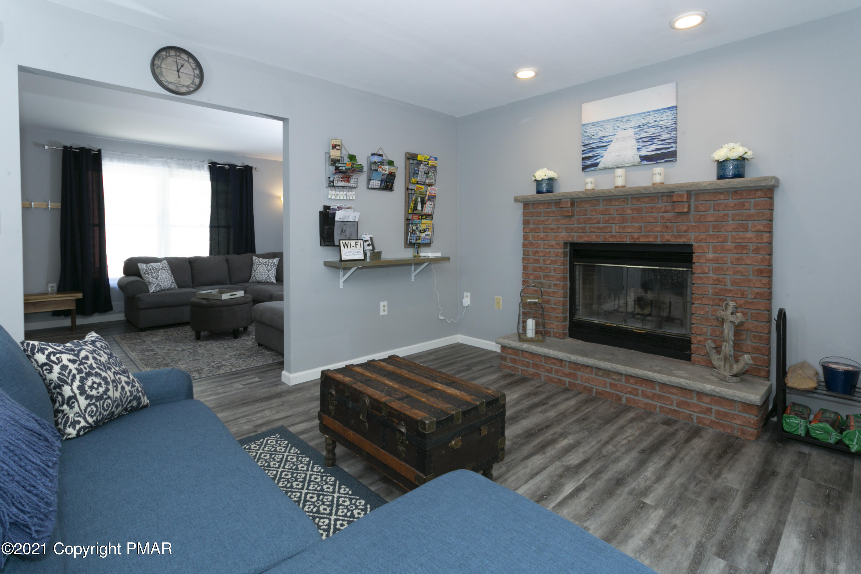 2155 Lancaster Drive Bushkill, PA 18324 - Photo 16 of 57 a living room with furniture and a fireplace