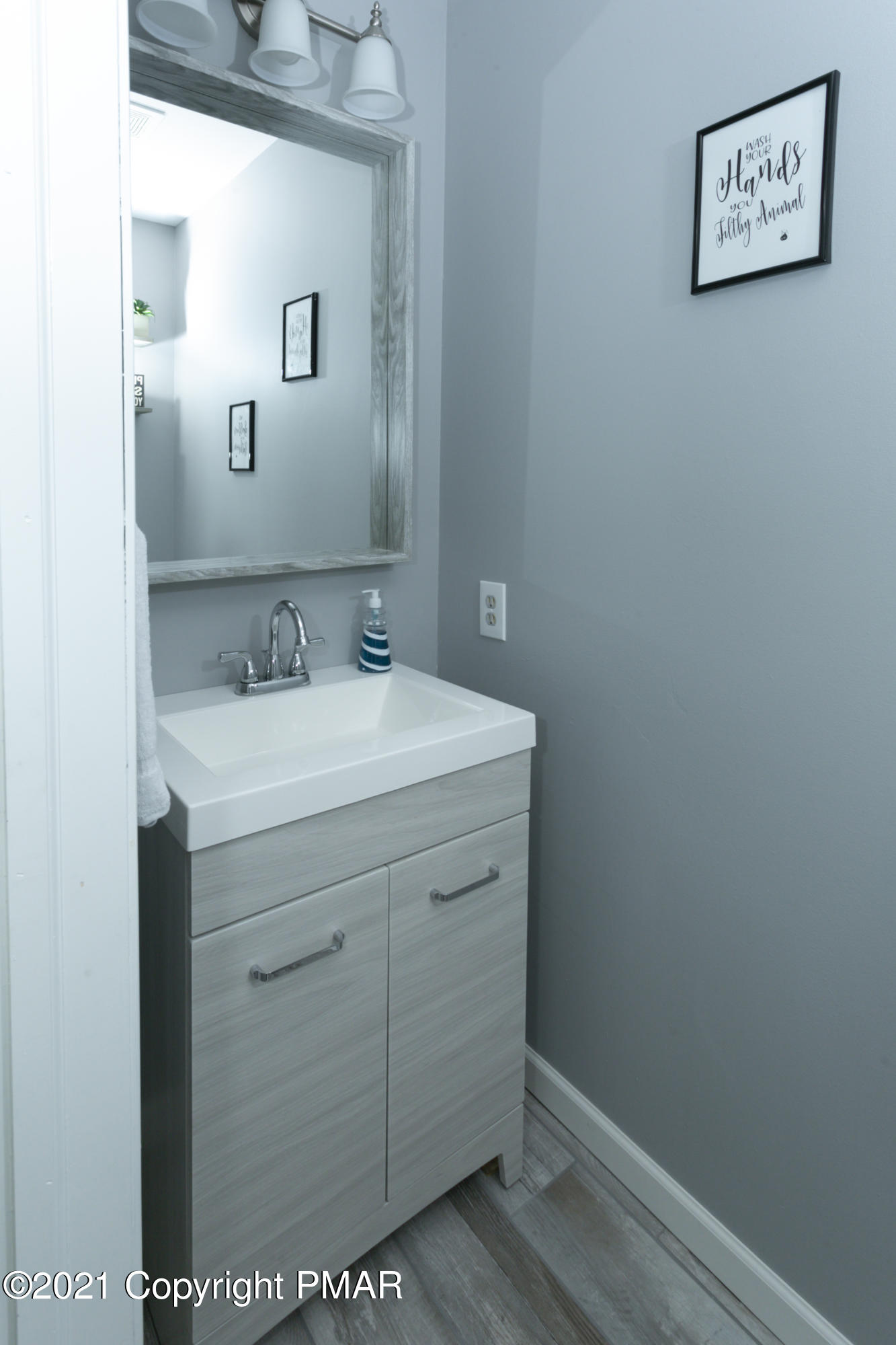 2155 Lancaster Drive Bushkill, PA 18324 - Photo 18 of 57 a bathroom with a sink and a mirror