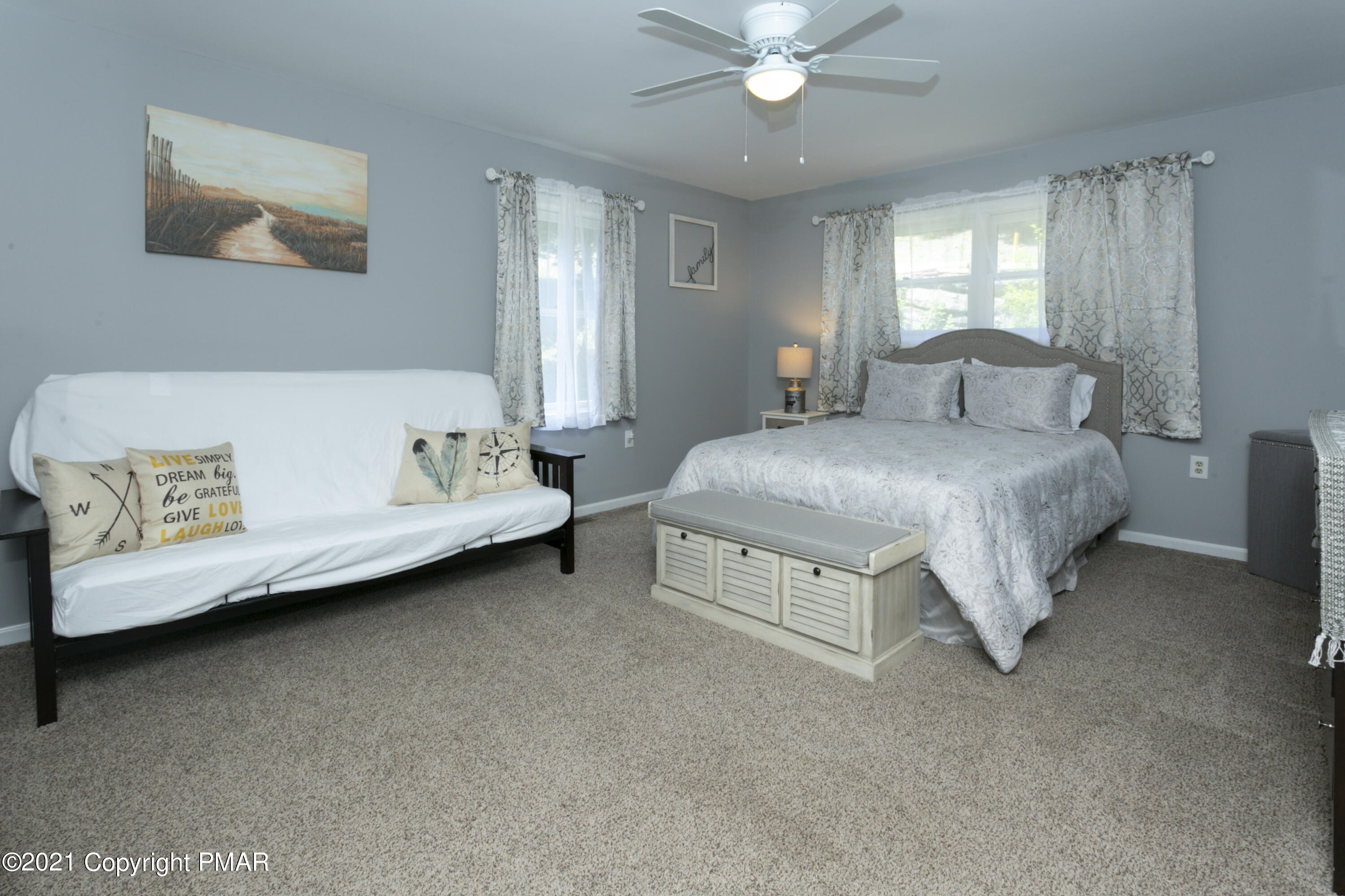 2155 Lancaster Drive Bushkill, PA 18324 - Photo 19 of 57 a spacious bedroom with a bed table and window