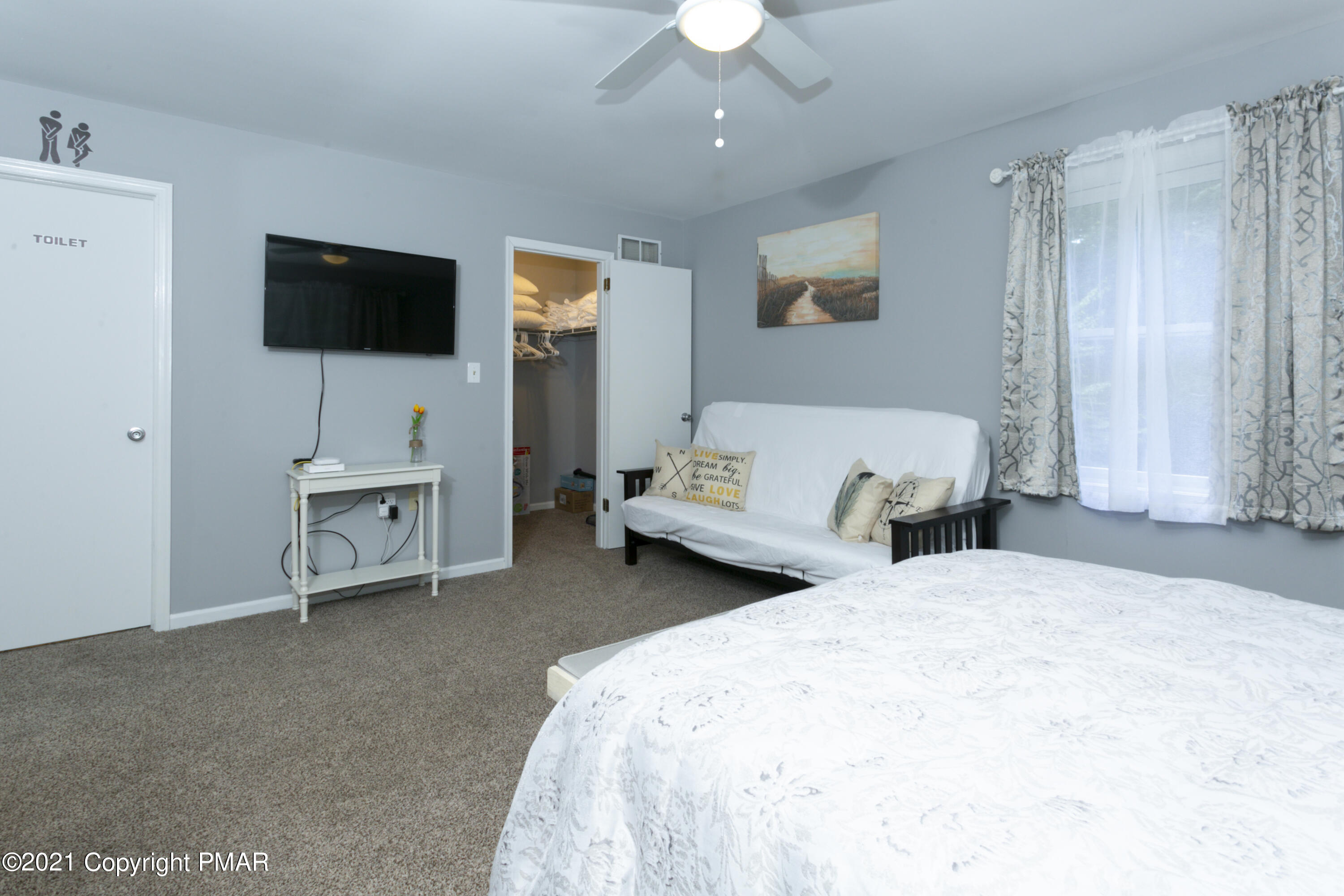 2155 Lancaster Drive Bushkill, PA 18324 - Photo 20 of 57 a spacious bedroom with two bed and a flat screen tv