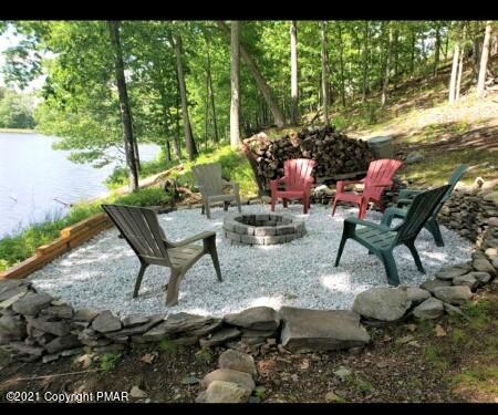 2155 Lancaster Drive Bushkill, PA 18324 - Photo 42 of 57 a backyard of a house with table and chairs