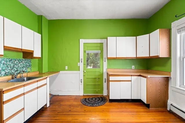 a kitchen with a sink and a large window