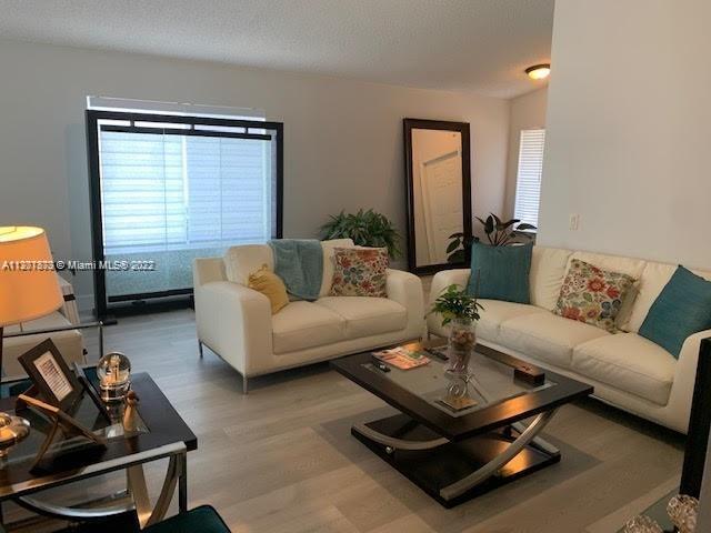 Savanna Weston, FL 33327 - Photo 1 of 24 a living room with furniture a rug and a window