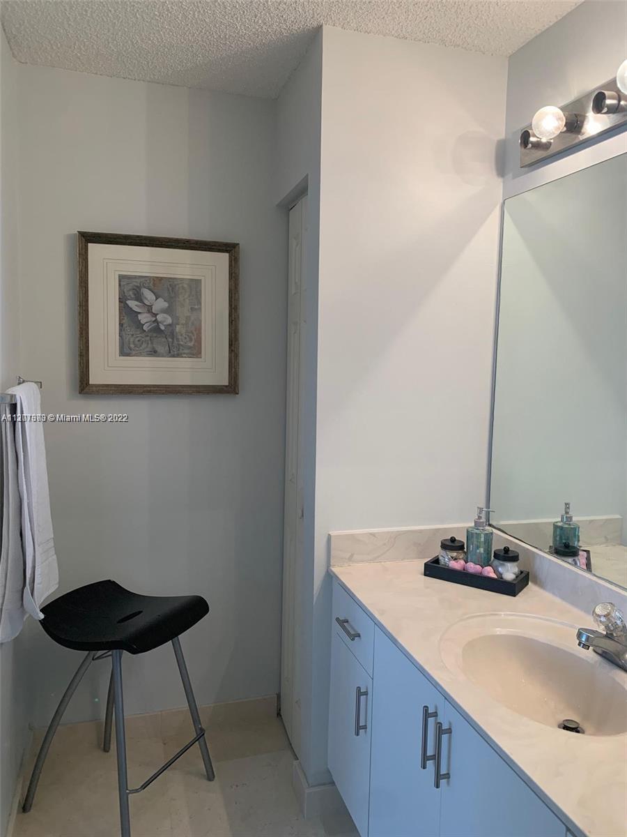 Savanna Weston, FL 33327 - Photo 18 of 24 a bathroom with a sink and a mirror