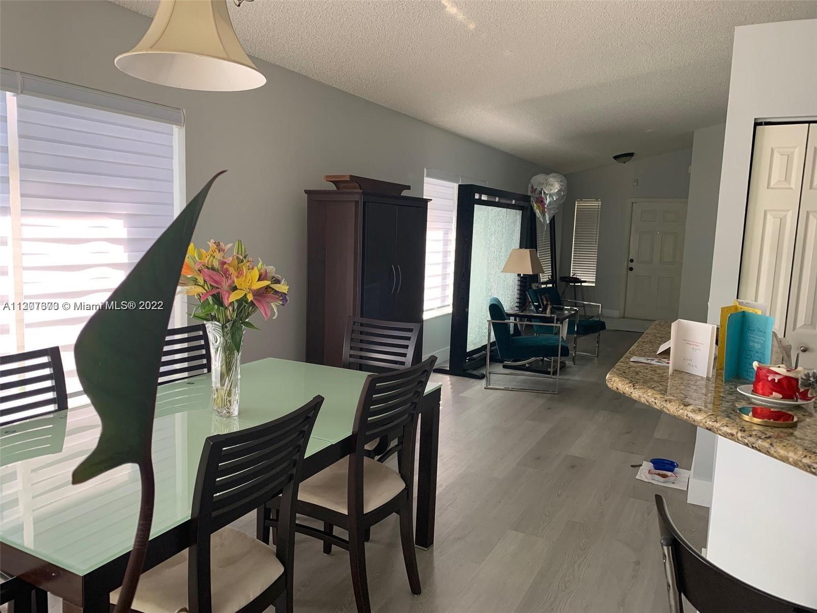 Savanna Weston, FL 33327 - Photo 3 of 24 a dining room with furniture and a chandelier