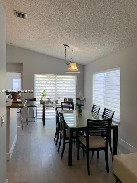 Savanna Weston, FL 33327 - Photo 7 of 24 a view of a dining room with furniture and window