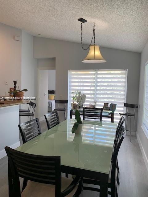 Savanna Weston, FL 33327 - Photo 8 of 24 a view of a dining room with furniture and wooden floor