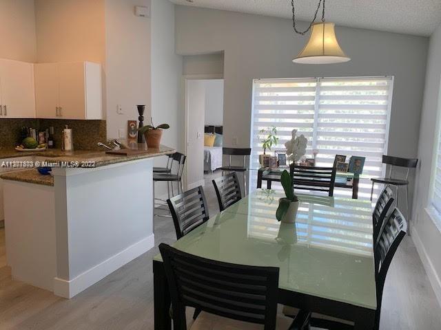 Savanna Weston, FL 33327 - Photo 10 of 24 a view of a dining room with furniture window and outside view