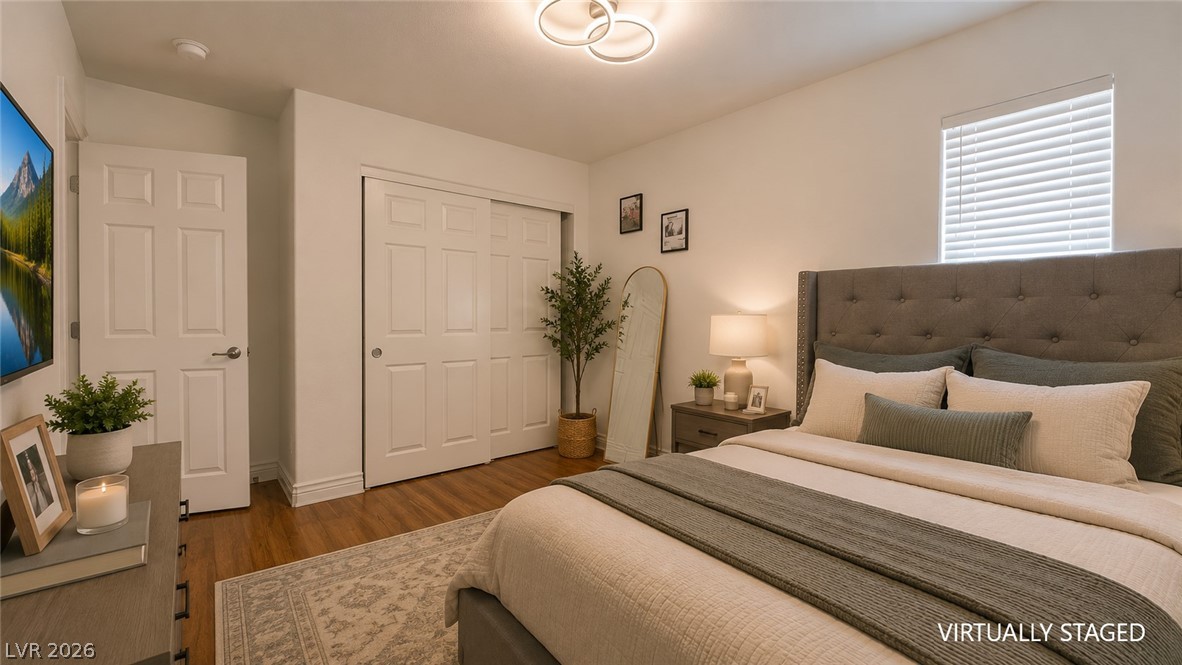 87 Tall Ruff Drive Las Vegas, NV 89148 - Photo 64 of 71 Hardwood floors and a well-lit space create a welcoming ambiance in this comfortable bedroom.