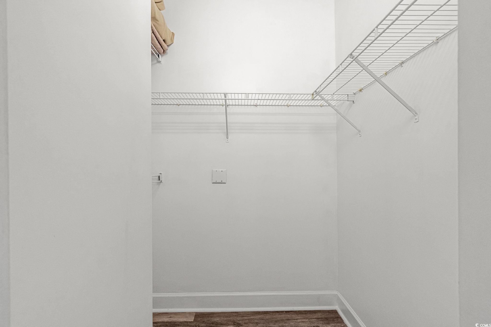 4815 Orchid Way, Unit 302 Myrtle Beach, SC 29577 - Photo 13 of 26 Spacious closet with dark wood-style floors