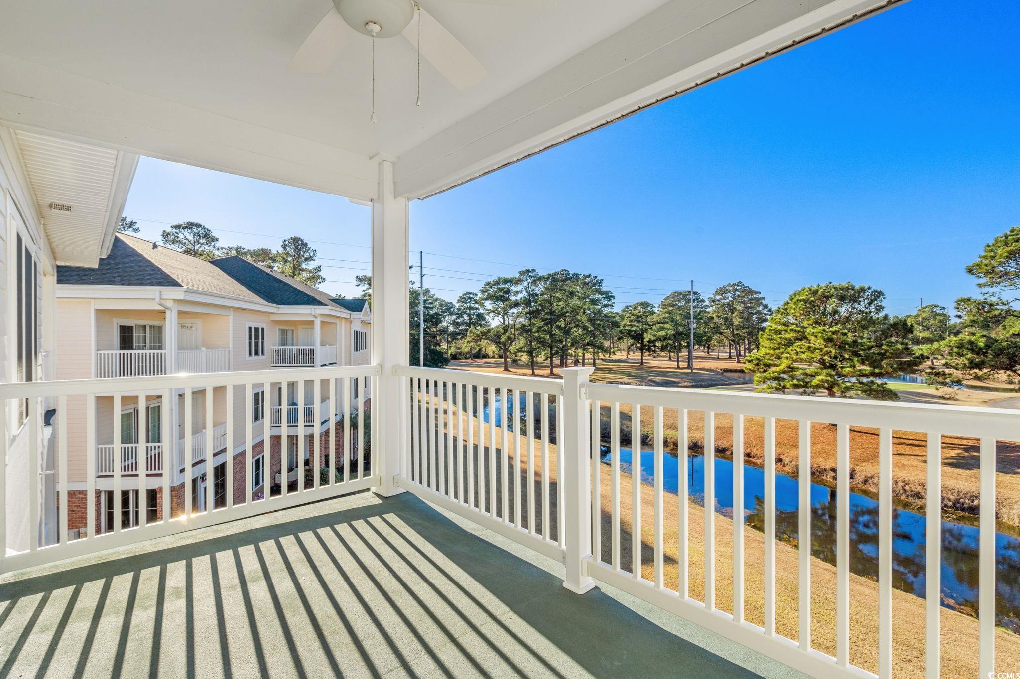 4815 Orchid Way, Unit 302 Myrtle Beach, SC 29577 - Photo 19 of 26 Balcony with ceiling fan and a sunroom