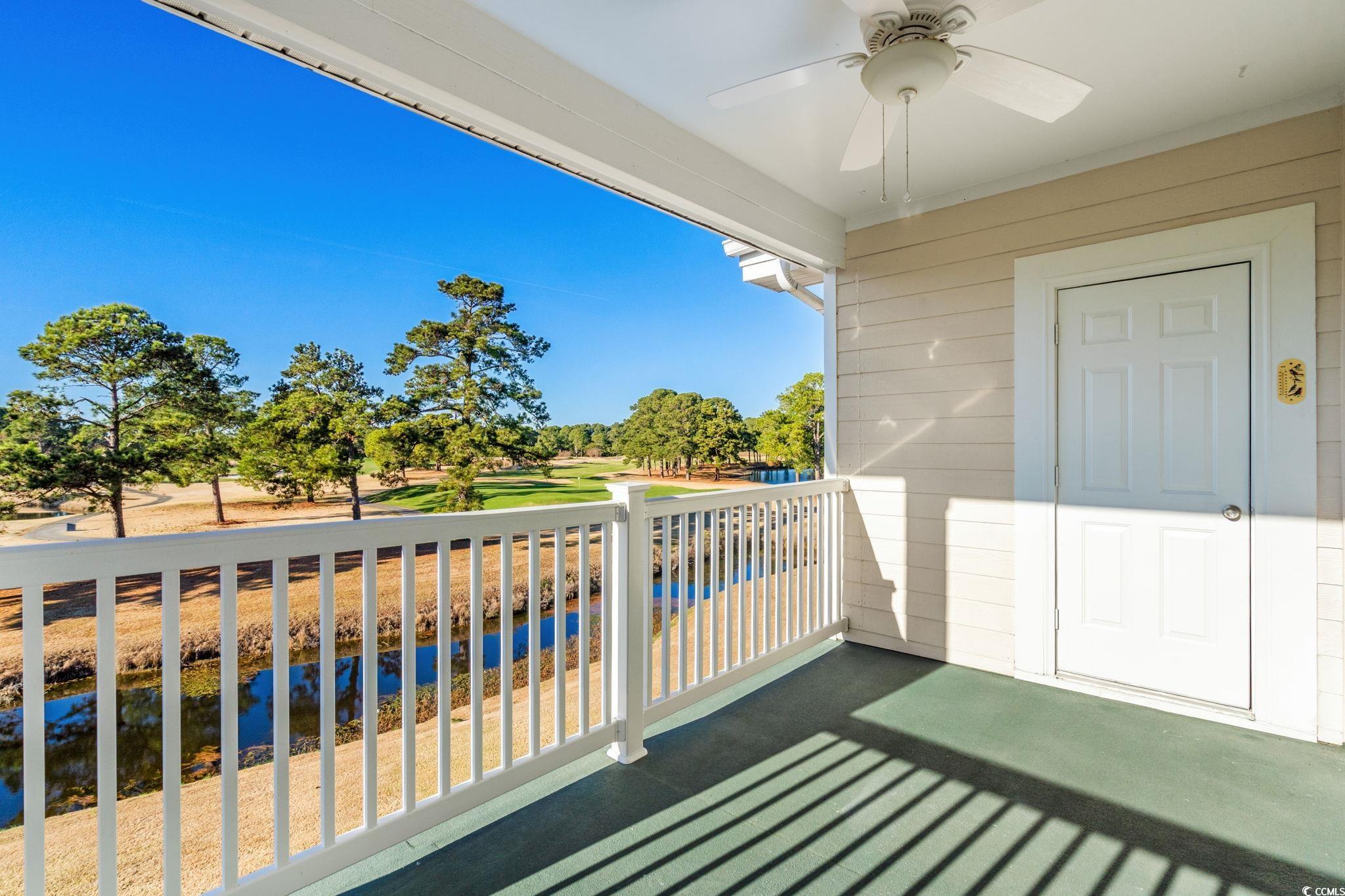 4815 Orchid Way, Unit 302 Myrtle Beach, SC 29577 - Photo 20 of 26 Balcony with ceiling fan and view of golf course
