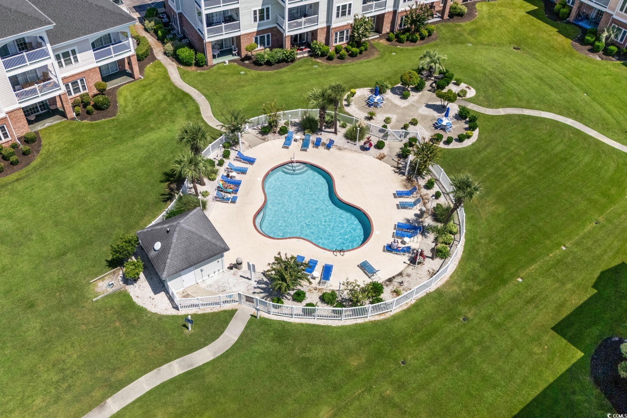 4815 Orchid Way, Unit 302 Myrtle Beach, SC 29577 - Photo 23 of 26 Aerial view of a pool area