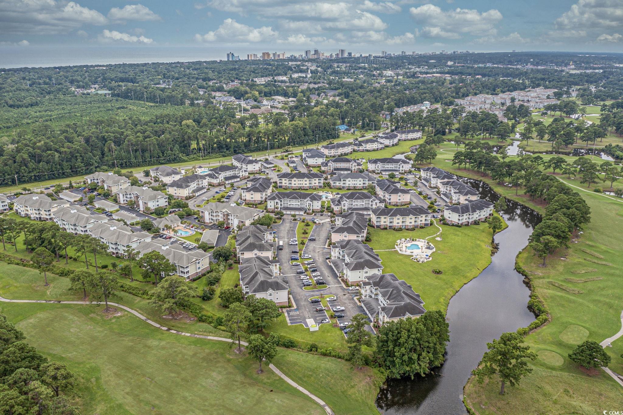 4815 Orchid Way, Unit 302 Myrtle Beach, SC 29577 - Photo 26 of 26 Aerial overview of property's location featuring a nearby body of water and skyline
