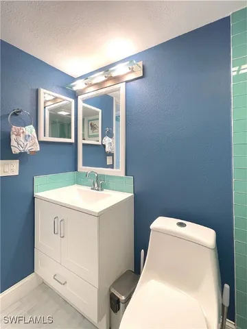 a bathroom with a shower and a sink