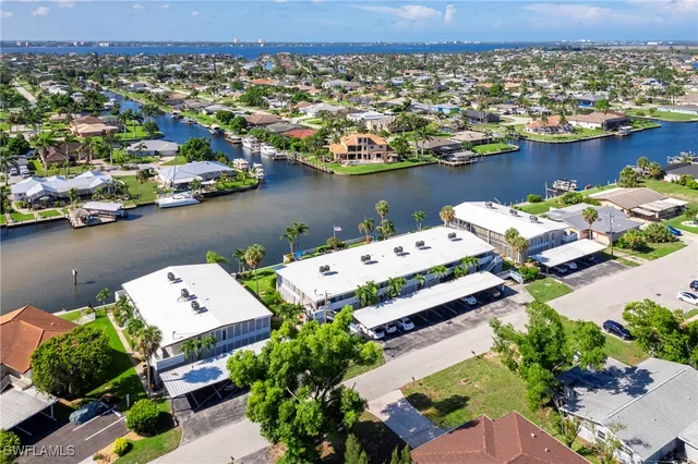an aerial view of a house with a lake view