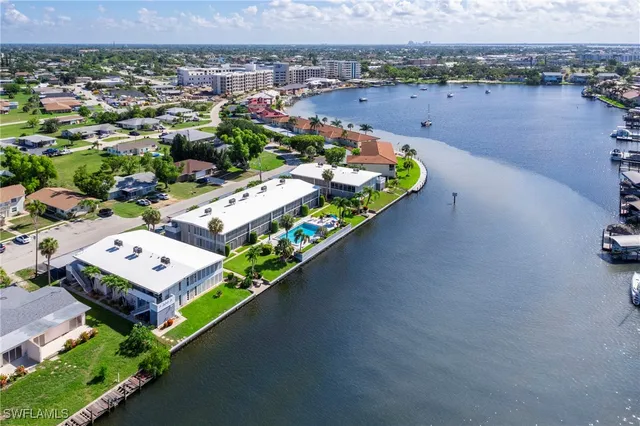 a view of backyard with outdoor seating and plants