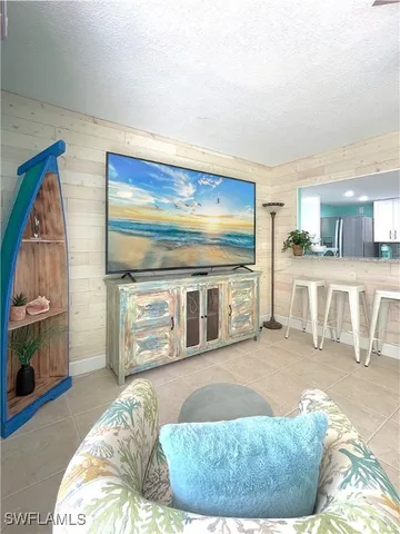 a living room with a couch and a fireplace