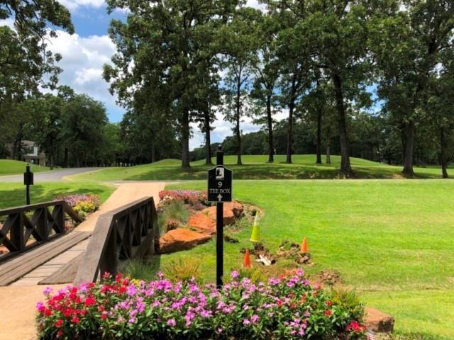 227 Colonial Drive Mabank, TX 75156 - Photo 11 of 23 a view of a garden with flowers and trees