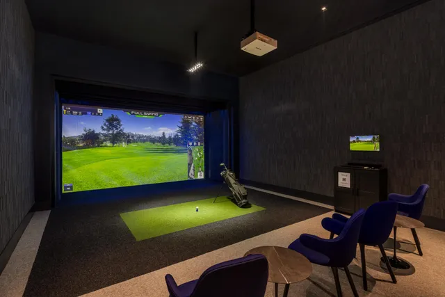 a lobby with furniture and a rug