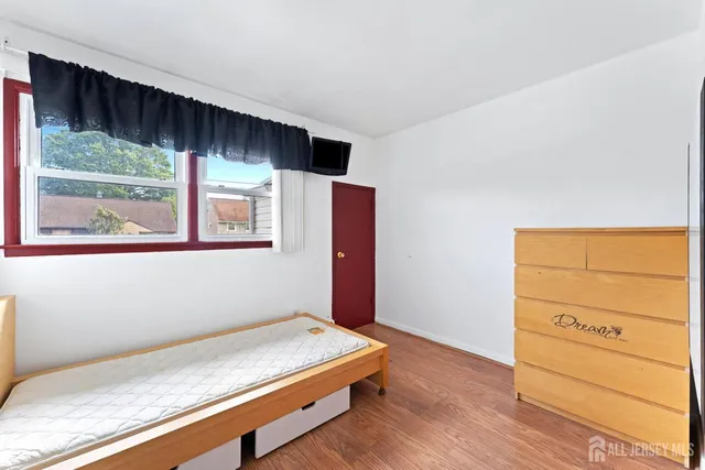 a room with a bed and a window