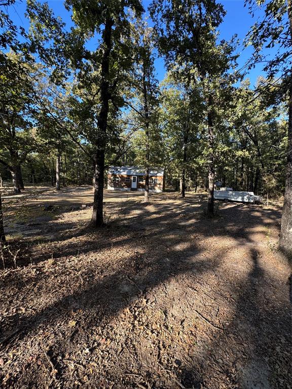 6171 Glen Oaks Road Mabank, TX 75156 - Photo 1 of 20 a view of road with trees