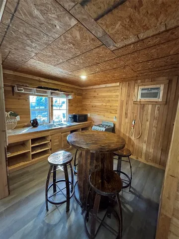 a room with lots of furniture and windows