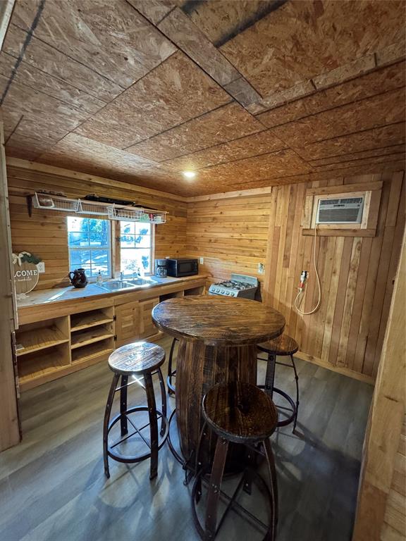 6171 Glen Oaks Road Mabank, TX 75156 - Photo 14 of 20 a kitchen with a table chairs and wooden floor