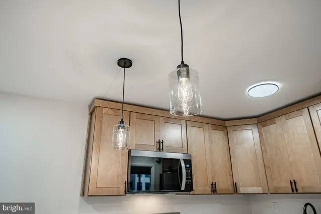 a view of a room with stainless steel appliances