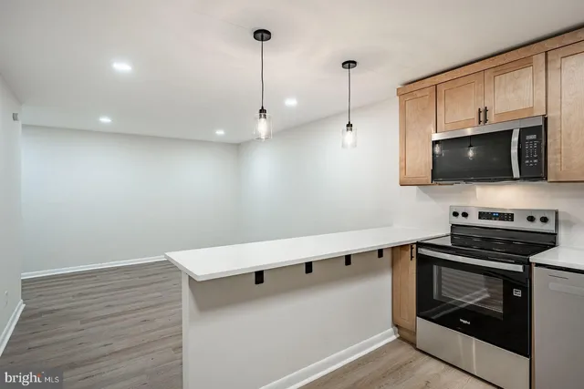 a kitchen with a stove and a microwave