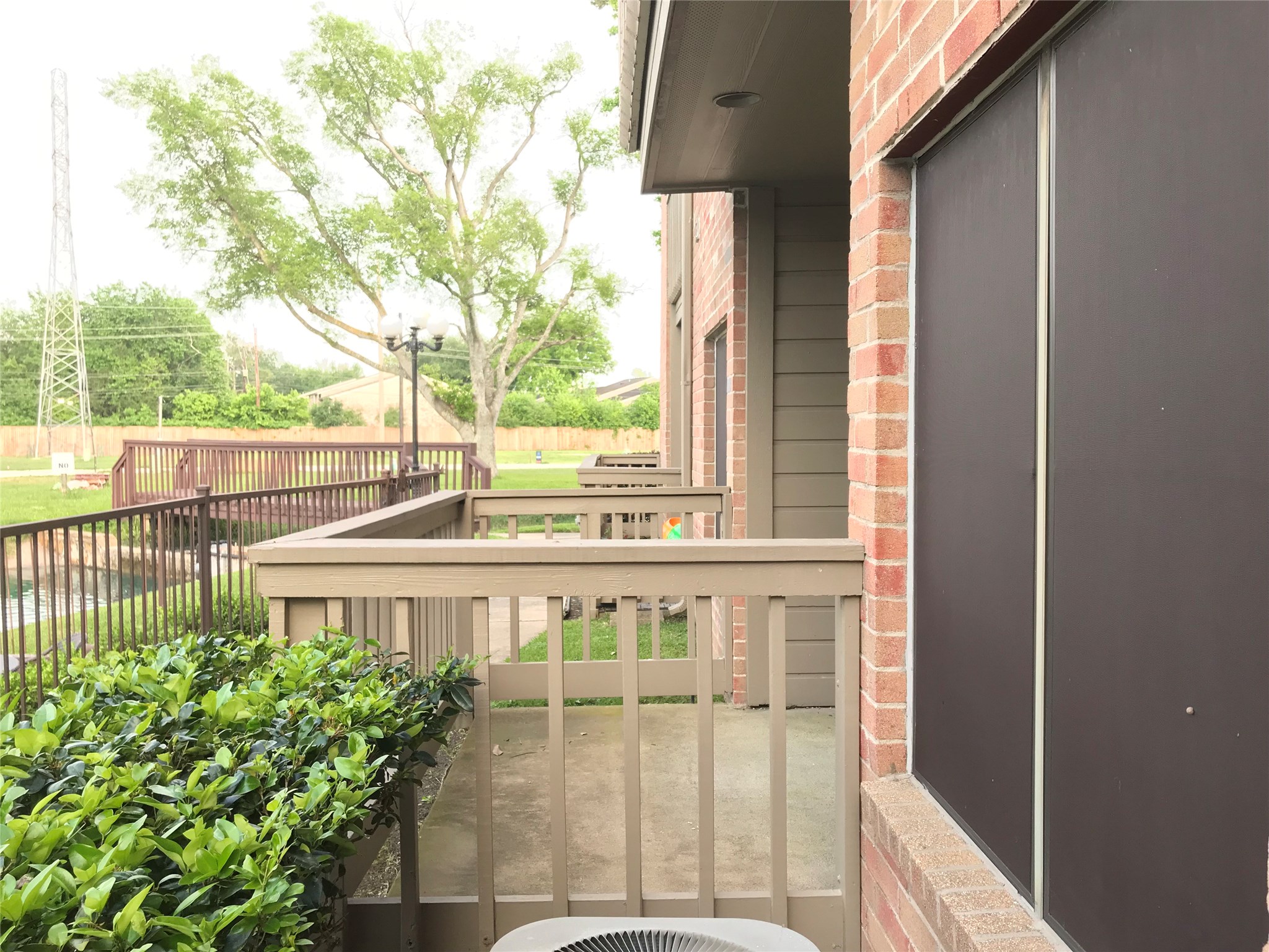 2023 Gentryside Drive, Unit 103 Houston, TX 77077 - Photo 3 of 33 Patio overlooking the Pool and Lake.