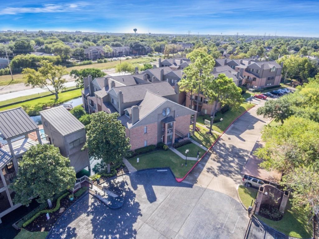 2023 Gentryside Drive, Unit 103 Houston, TX 77077 - Photo 3 of 36 an aerial view of residential houses with outdoor space and ocean view
