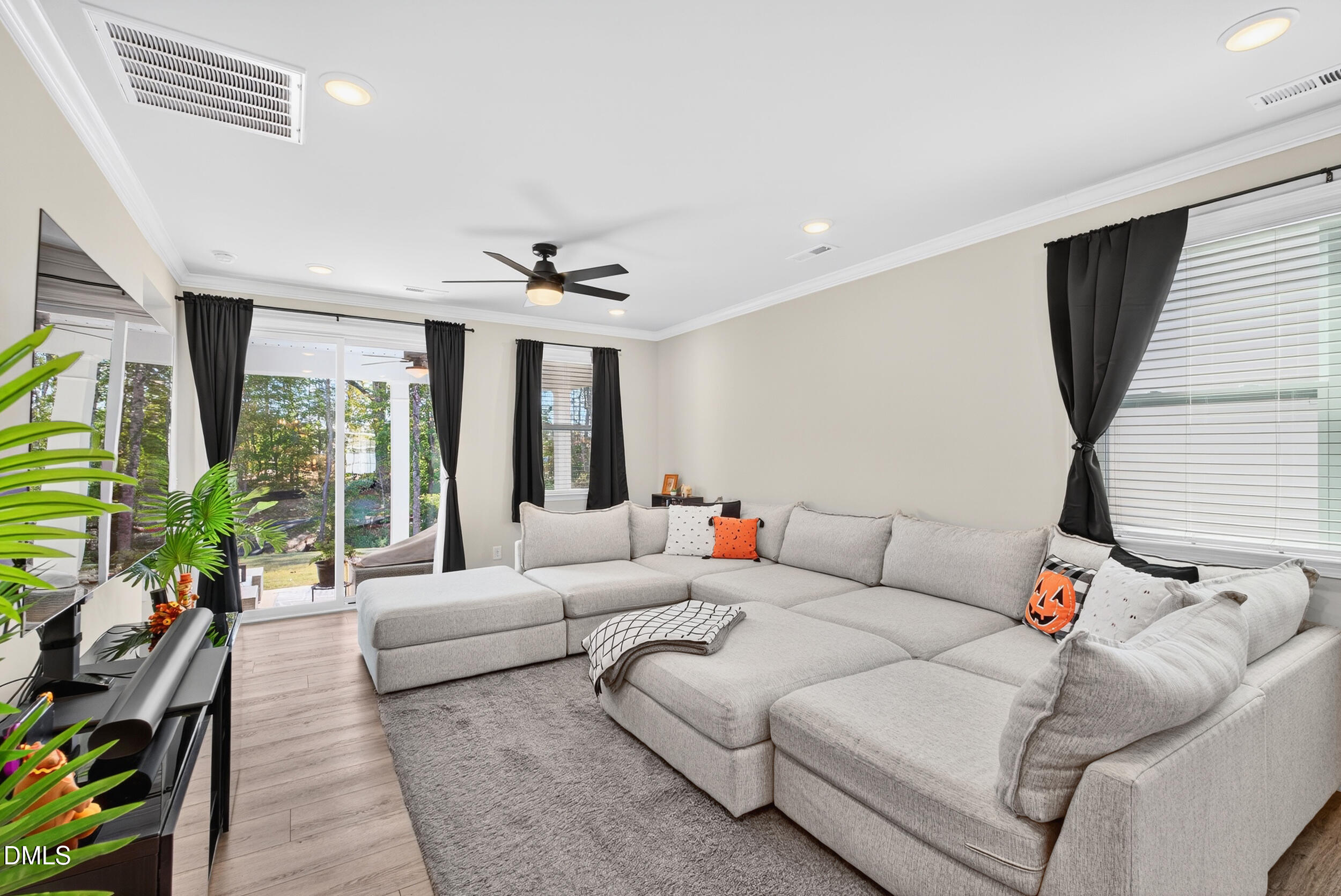 143 Umbrella Way Garner, NC 27529 - Photo 11 of 32 a living room with furniture and a large window