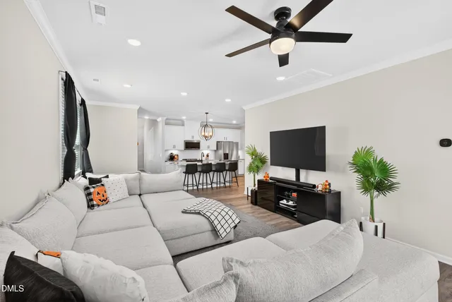 a living room with furniture and a rug