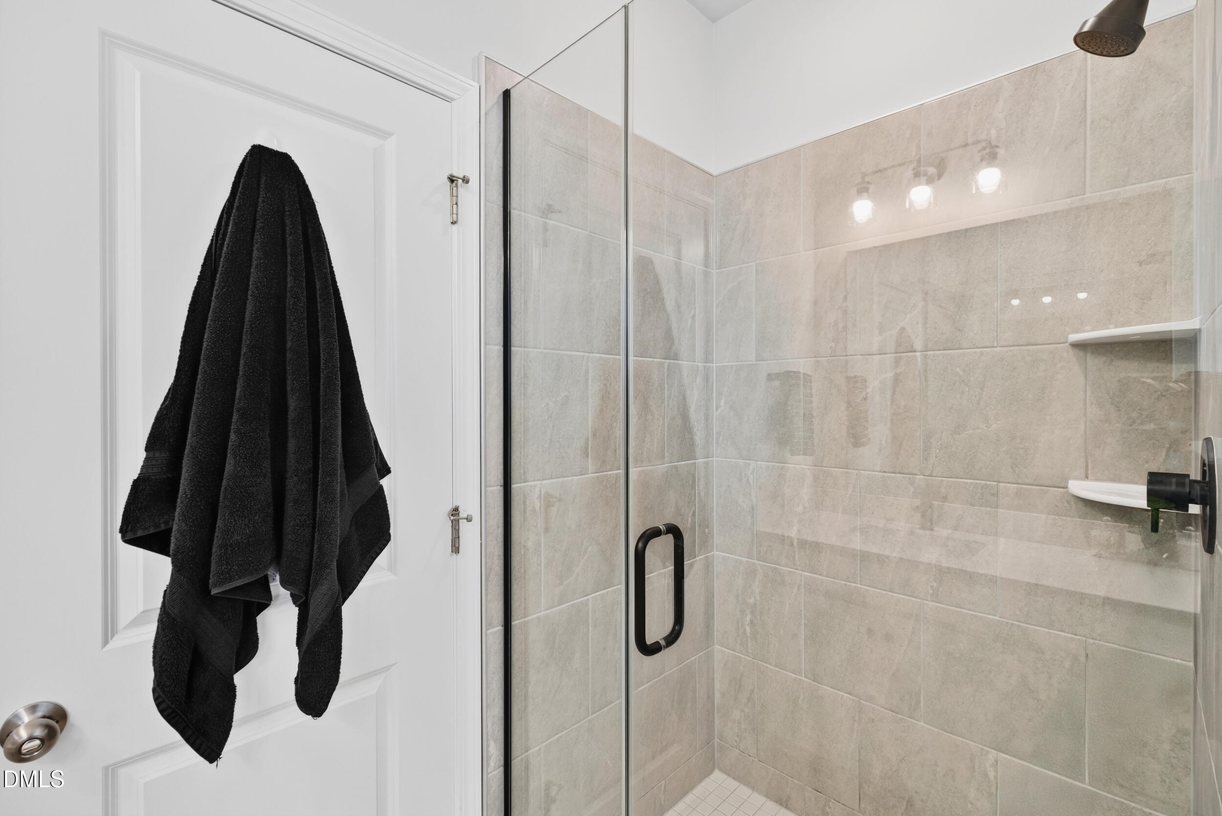 143 Umbrella Way Garner, NC 27529 - Photo 19 of 32 a bathroom with a shower