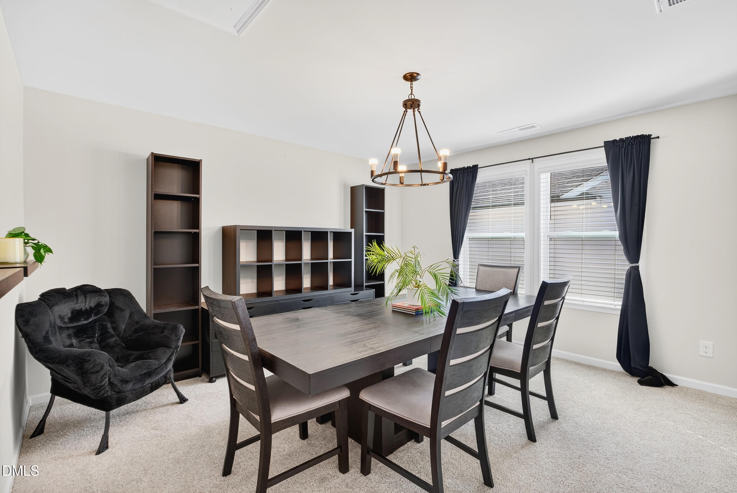 143 Umbrella Way Garner, NC 27529 - Photo 20 of 32 a view of a dining room with furniture and wooden floor
