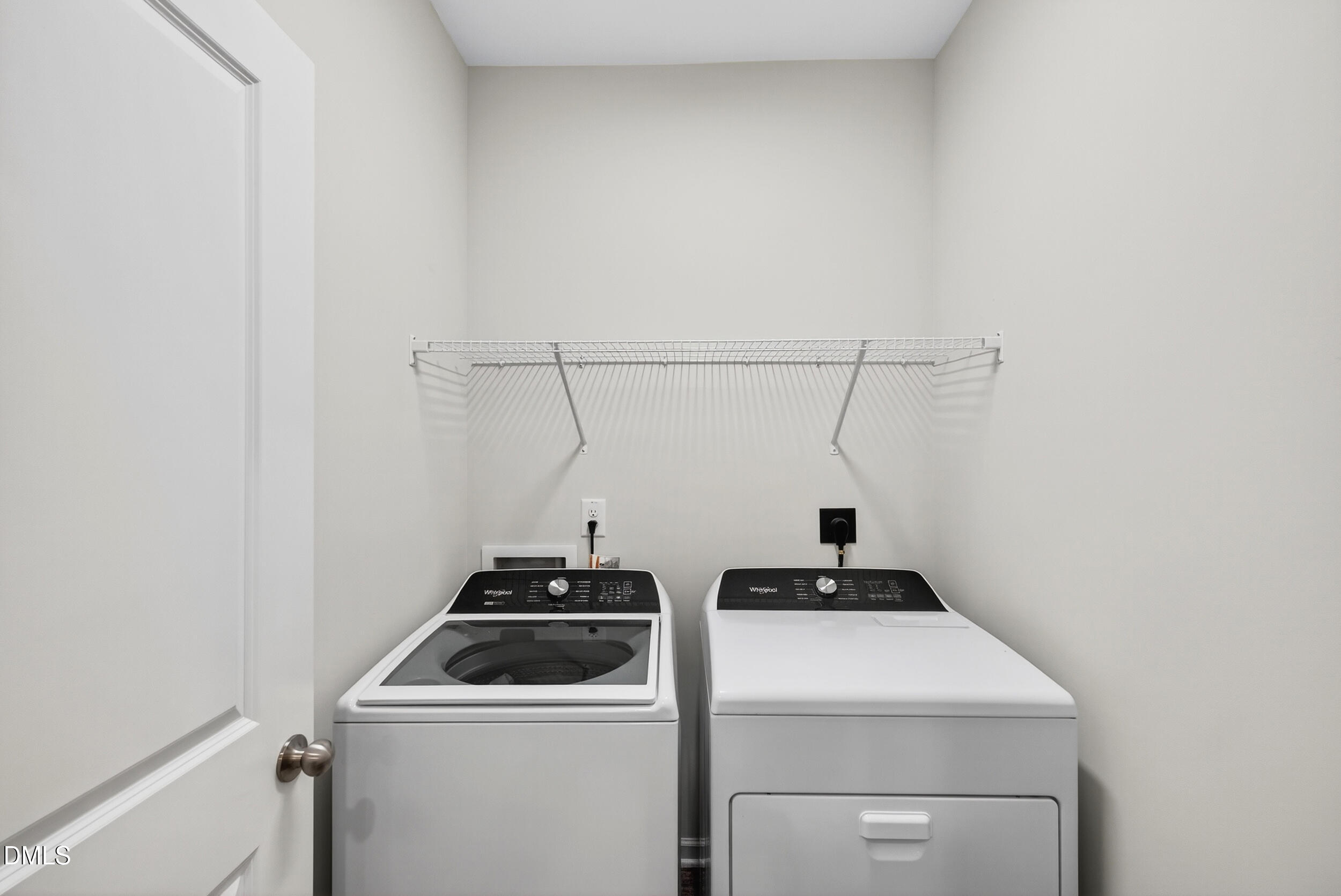 143 Umbrella Way Garner, NC 27529 - Photo 24 of 32 a view of storage and utility room with washer and dryer