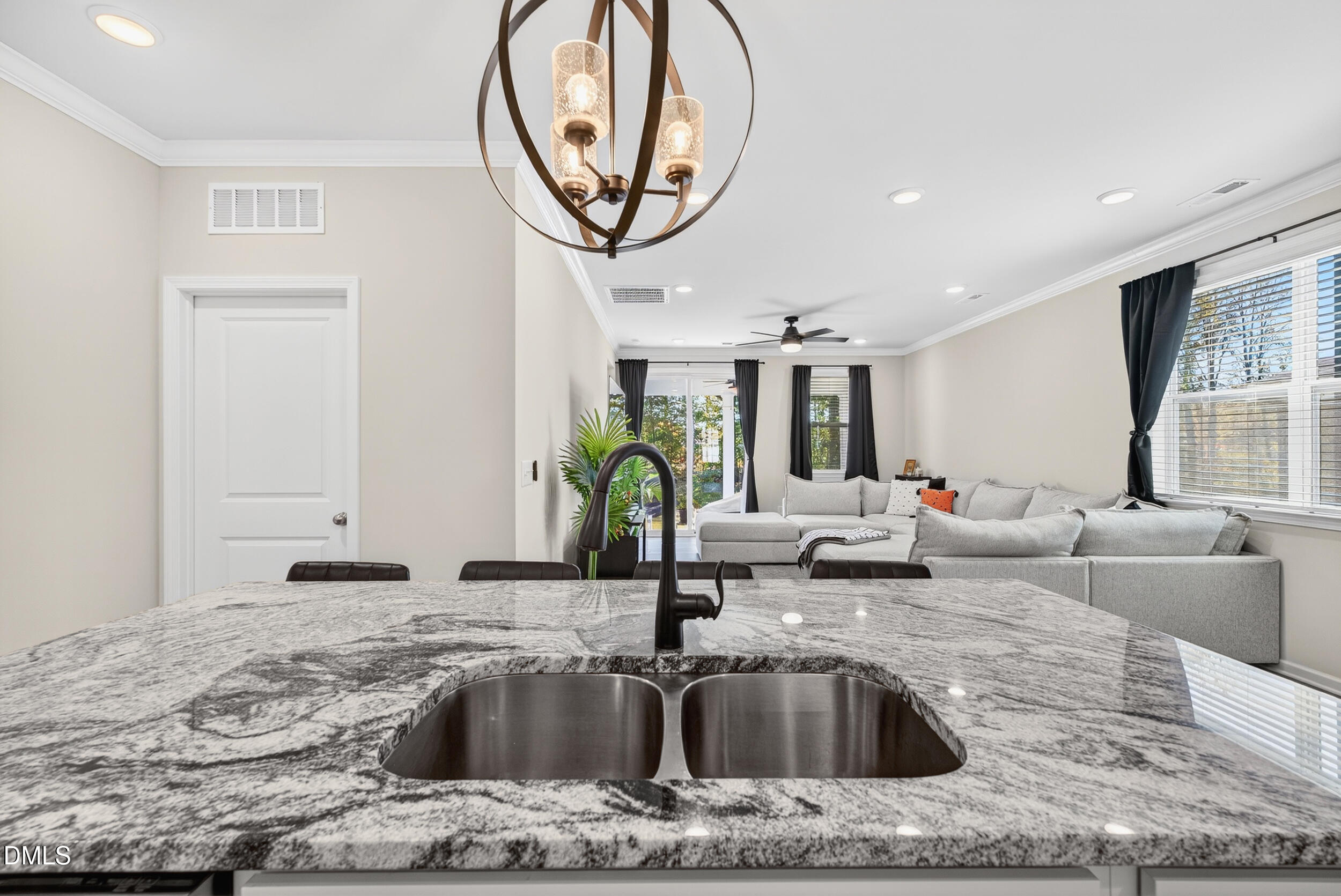 143 Umbrella Way Garner, NC 27529 - Photo 10 of 32 a kitchen with a sink and a granite top table