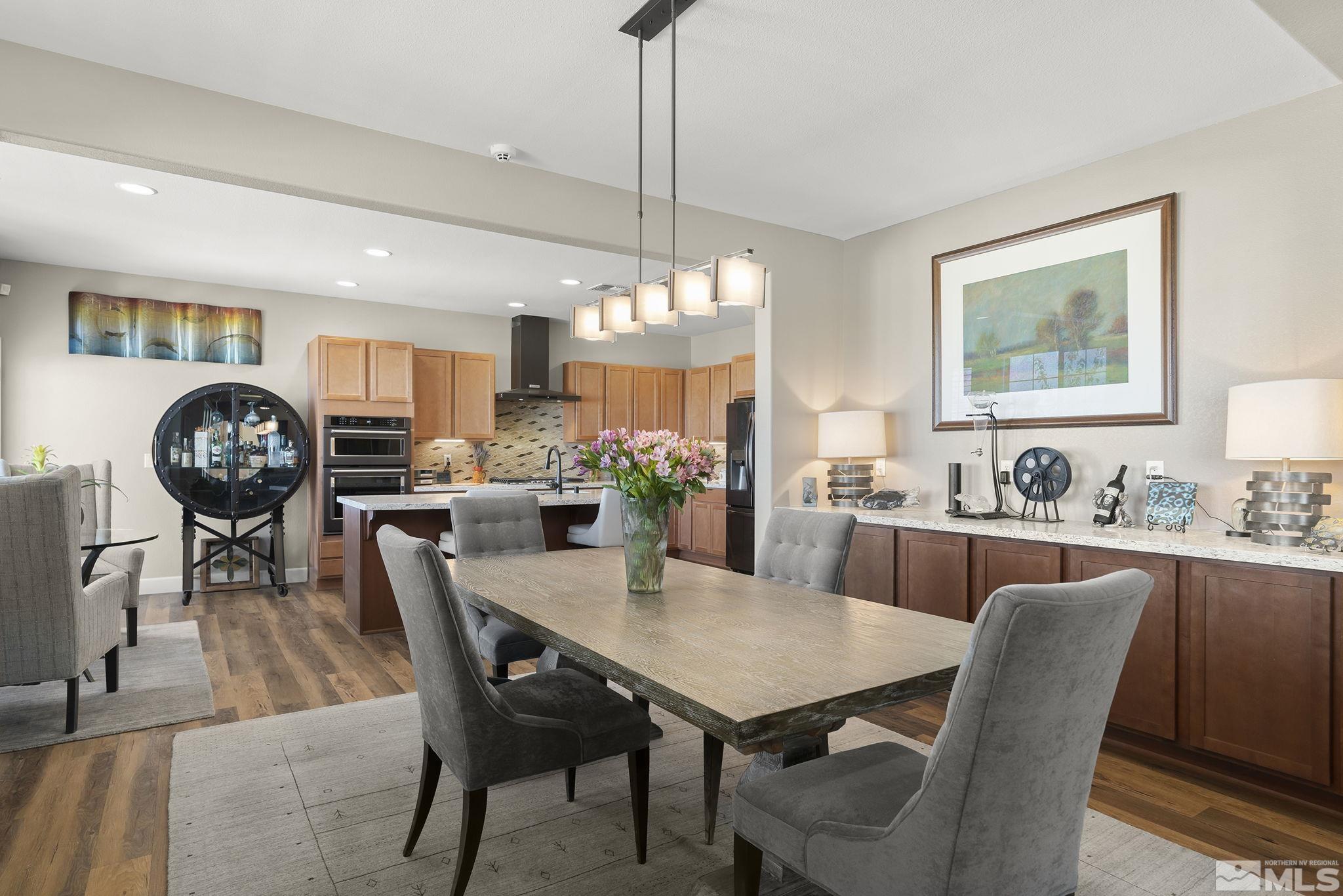 2239 Windflower Drive Reno, NV 89521 - Photo 11 of 40 a view of a dining room with furniture window and wooden floor
