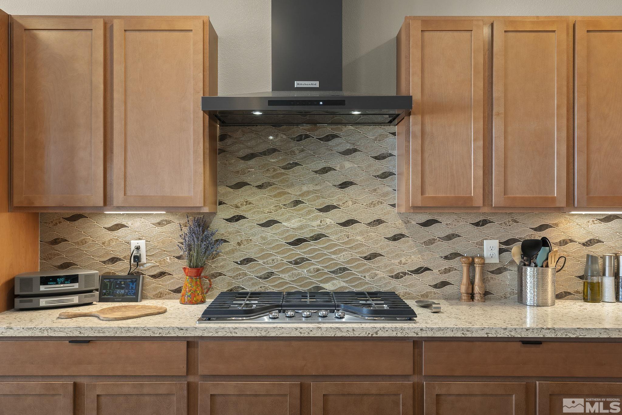 2239 Windflower Drive Reno, NV 89521 - Photo 17 of 40 a kitchen with granite countertop a sink and cabinets