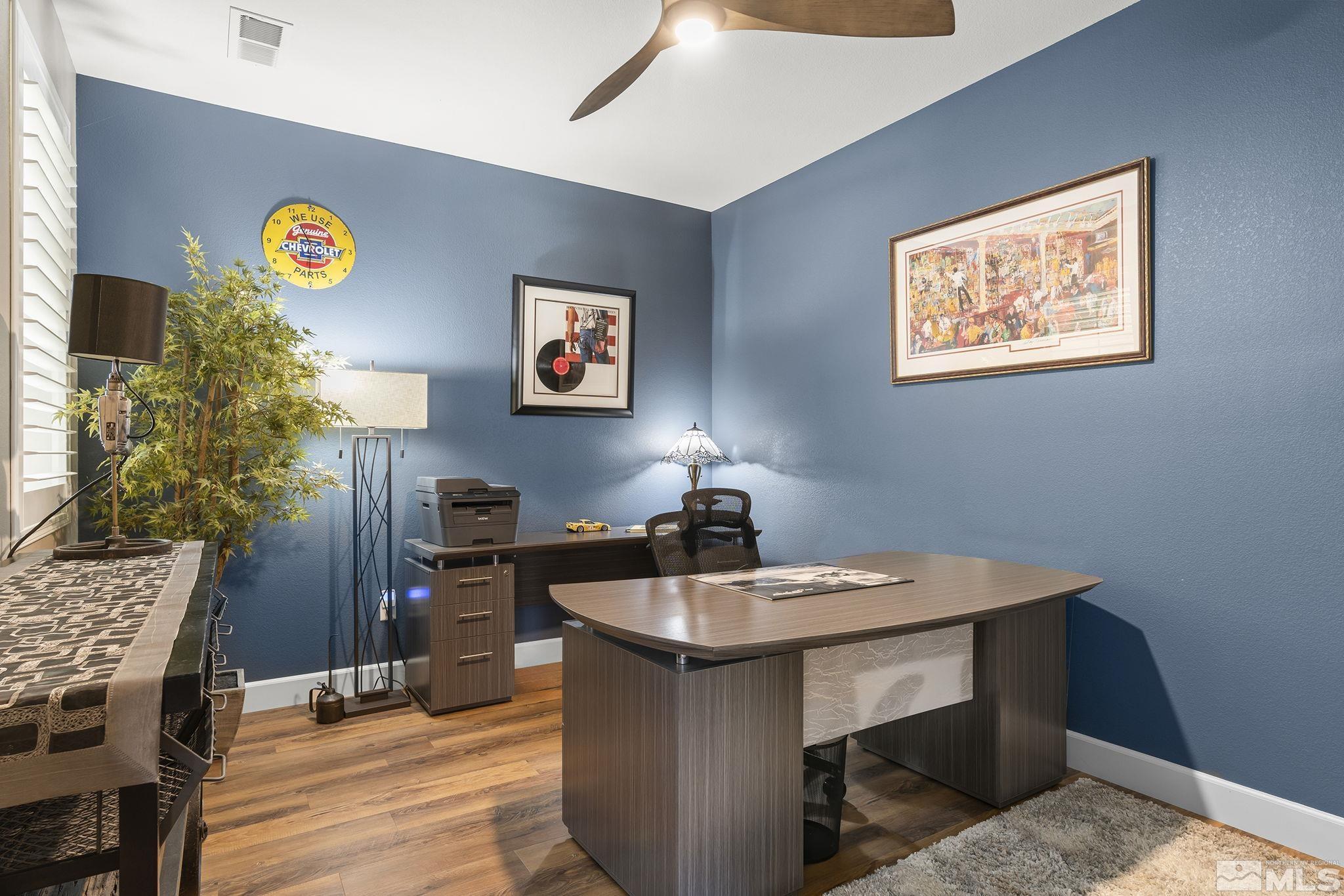 2239 Windflower Drive Reno, NV 89521 - Photo 19 of 40 a workspace with furniture and lamp