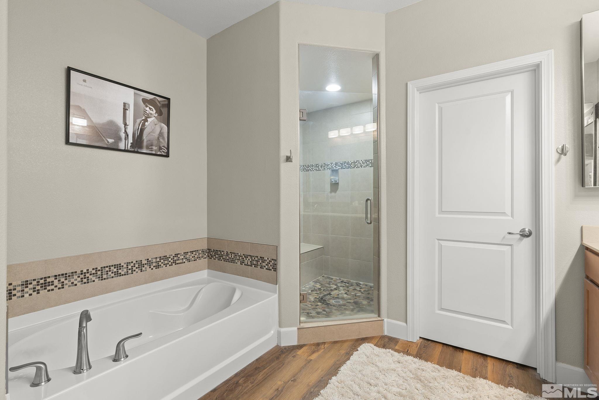 2239 Windflower Drive Reno, NV 89521 - Photo 22 of 40 a bathroom with a bathtub and shower