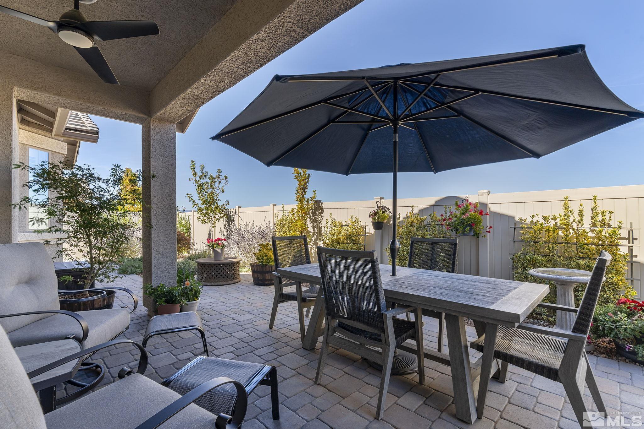 2239 Windflower Drive Reno, NV 89521 - Photo 28 of 40 a view of an outdoor space with furniture and umbrella