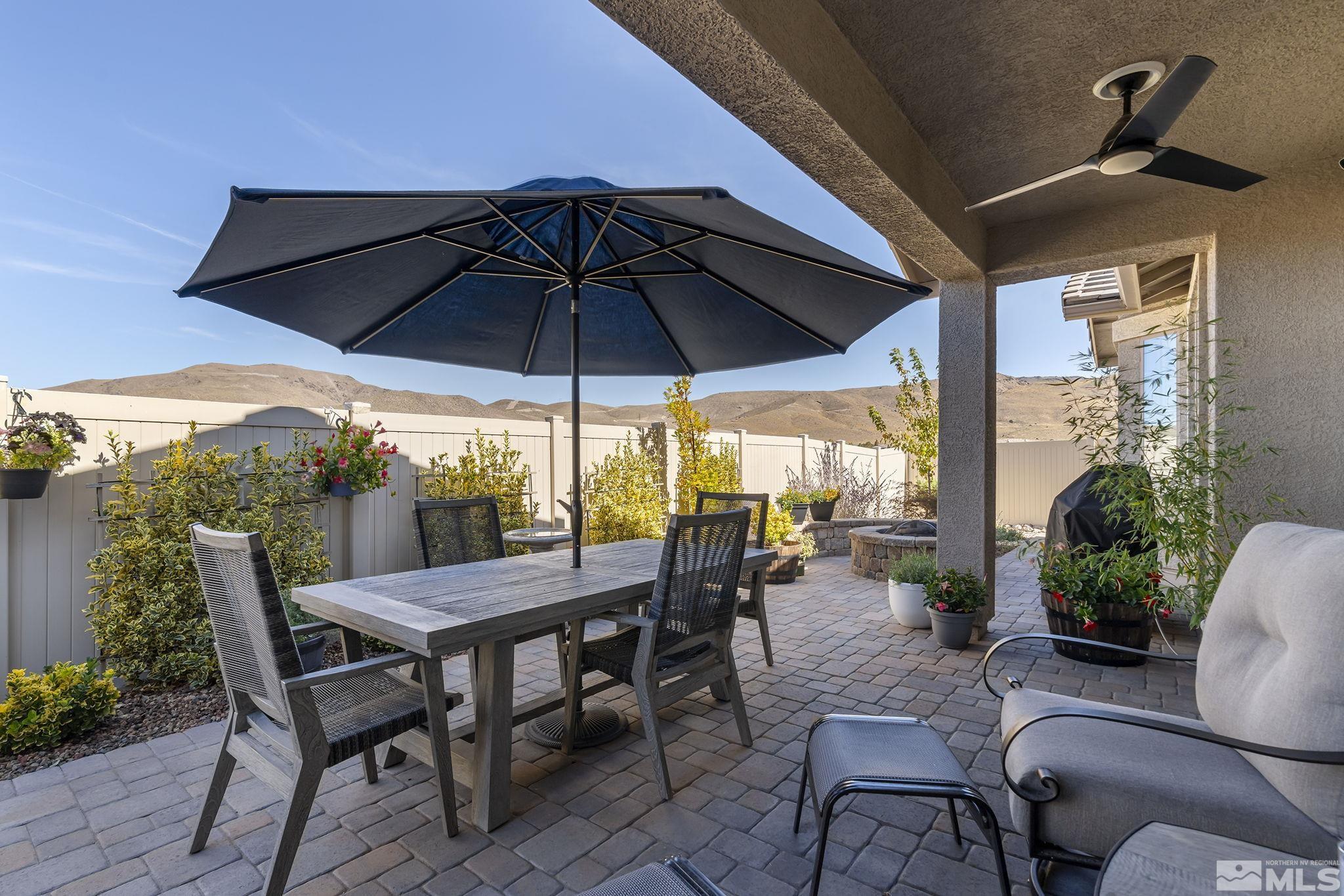 2239 Windflower Drive Reno, NV 89521 - Photo 29 of 40 a view of an outdoor space with furniture and umbrella