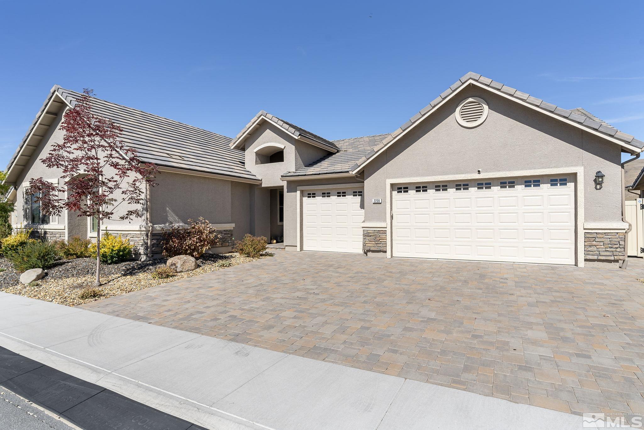 2239 Windflower Drive Reno, NV 89521 - Photo 3 of 40 a view of a house with a outdoor space