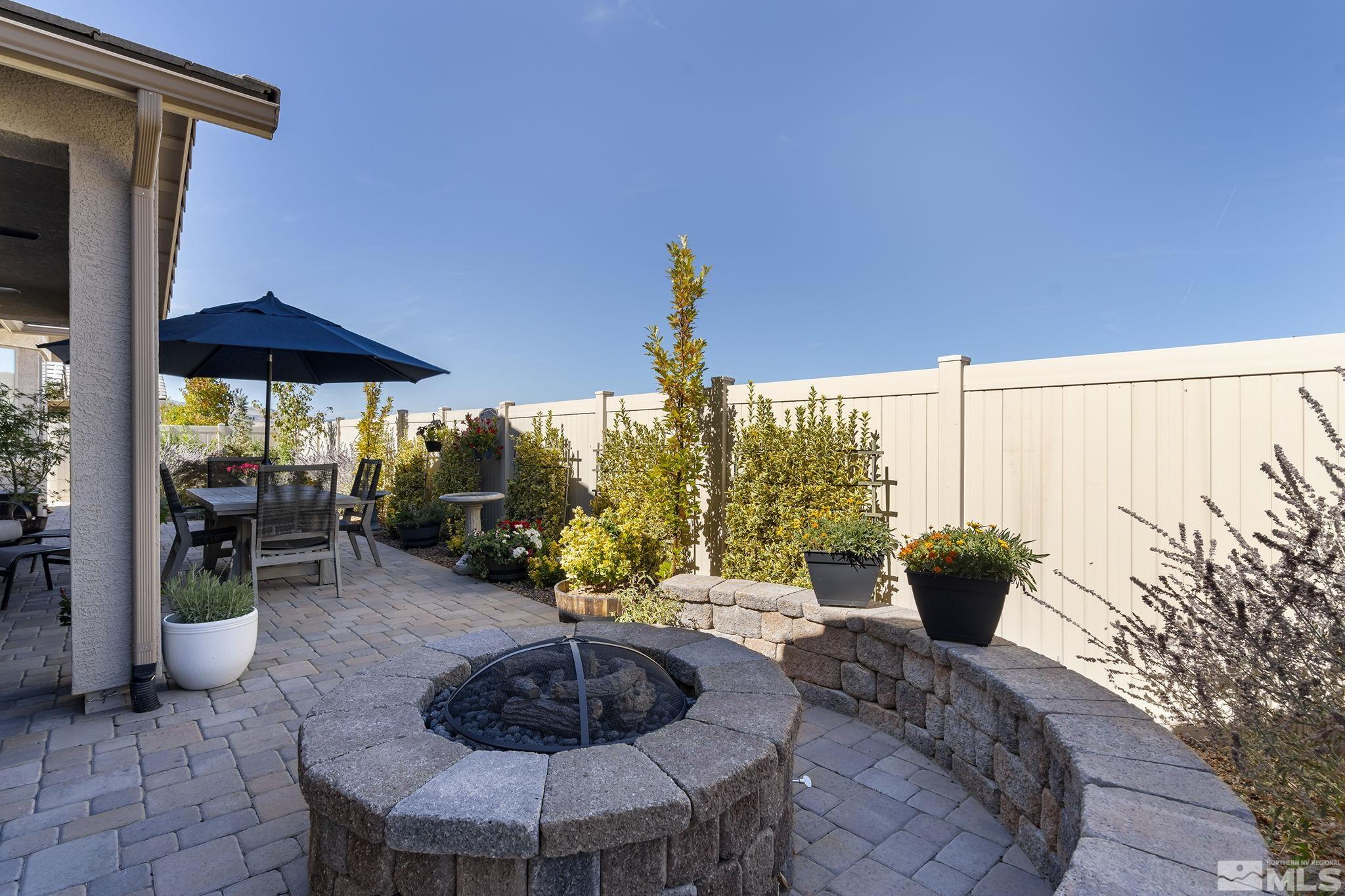 2239 Windflower Drive Reno, NV 89521 - Photo 31 of 40 a view of a patio with chairs and potted plants