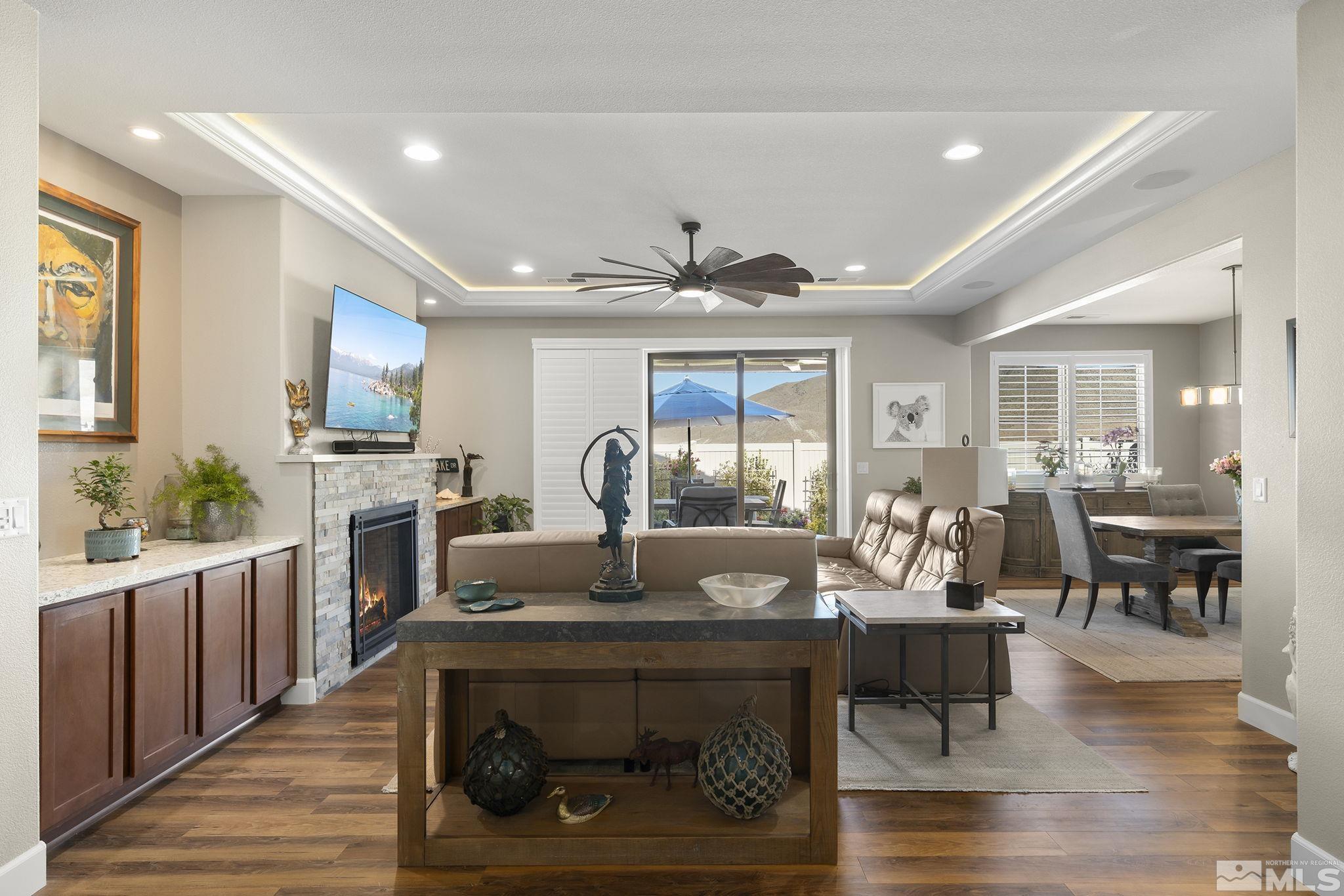 2239 Windflower Drive Reno, NV 89521 - Photo 5 of 40 a living room with fireplace furniture and a wooden floor