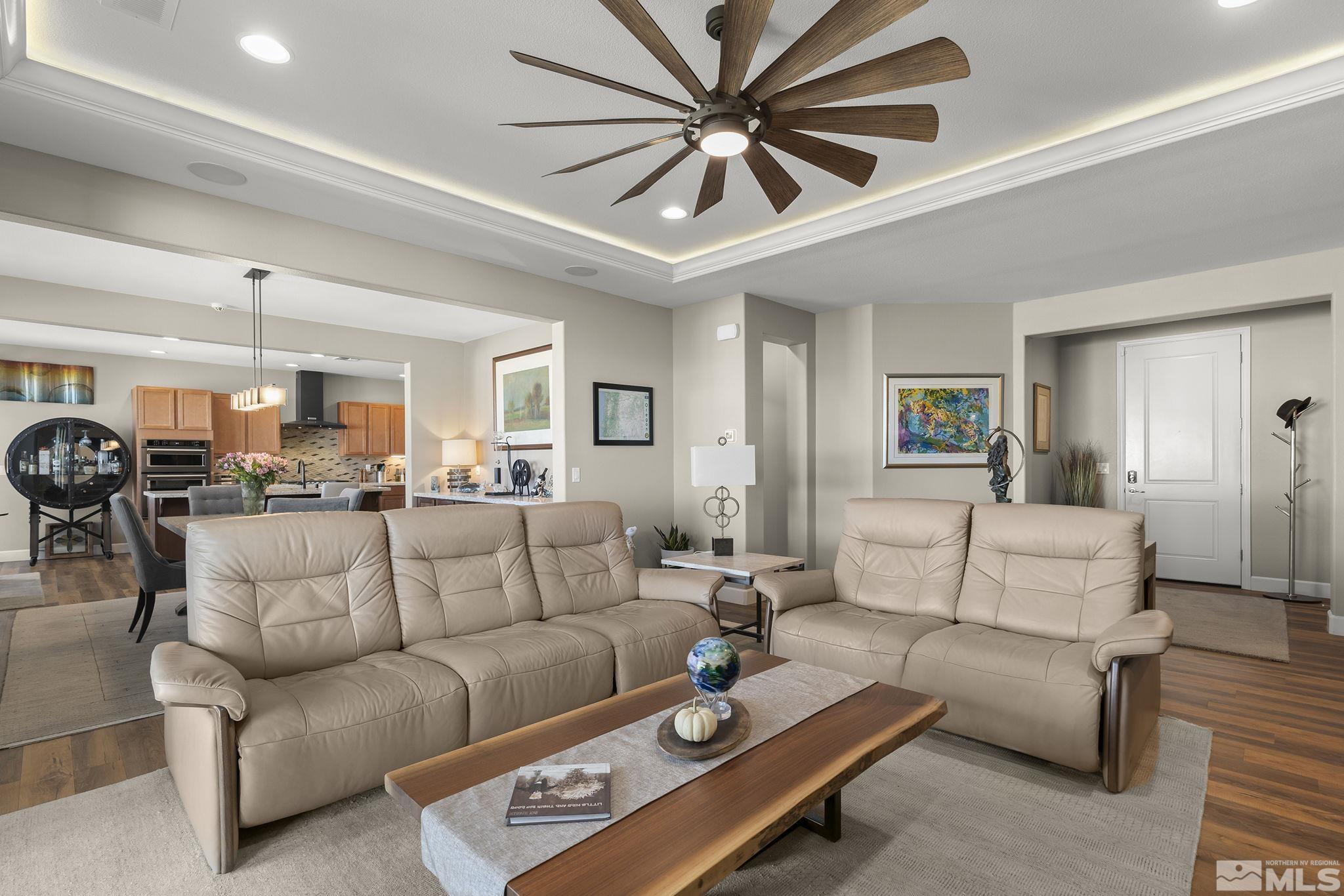 2239 Windflower Drive Reno, NV 89521 - Photo 8 of 40 a living room with furniture a table and a chandelier