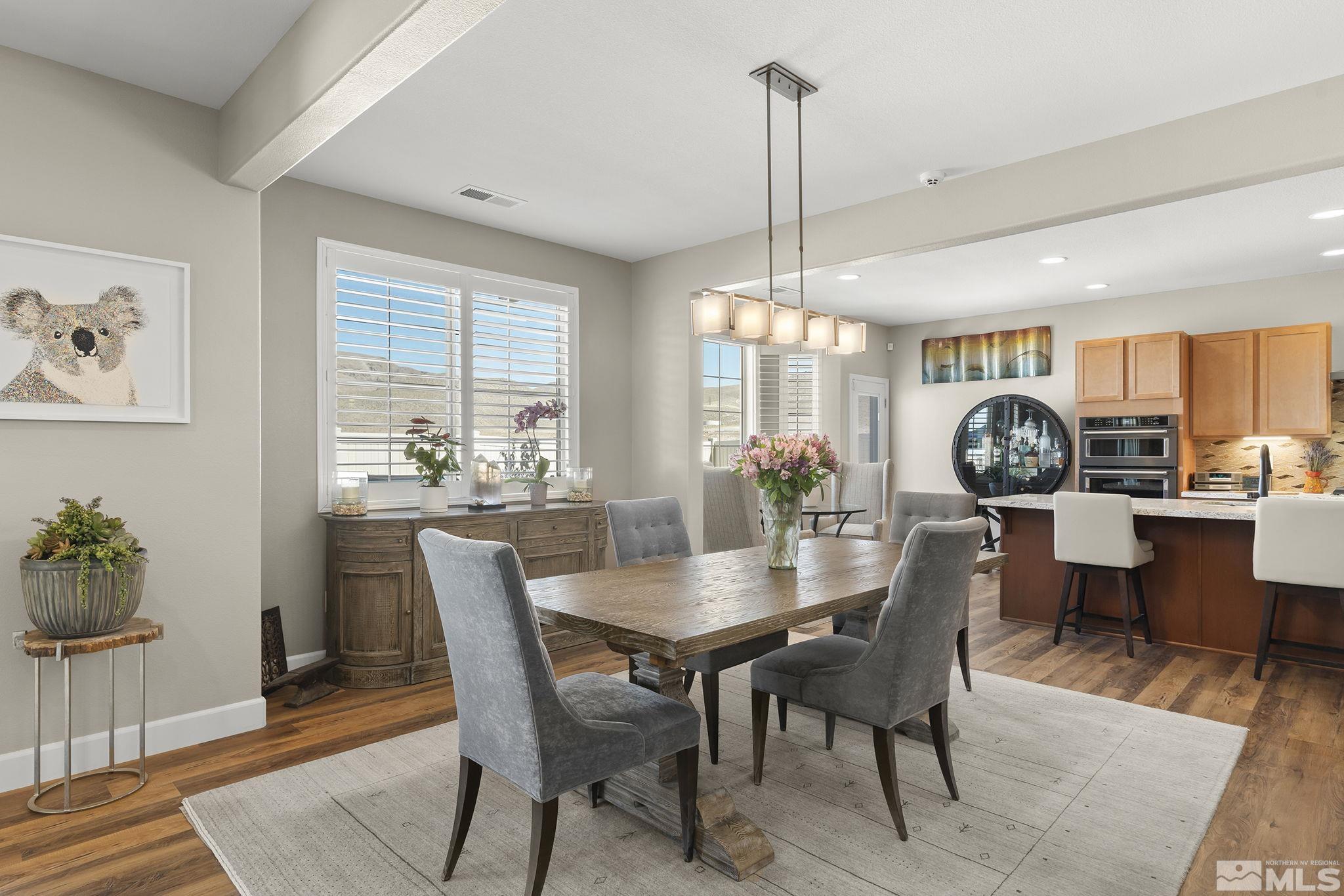 2239 Windflower Drive Reno, NV 89521 - Photo 10 of 40 a view of a dining room with furniture window and wooden floor