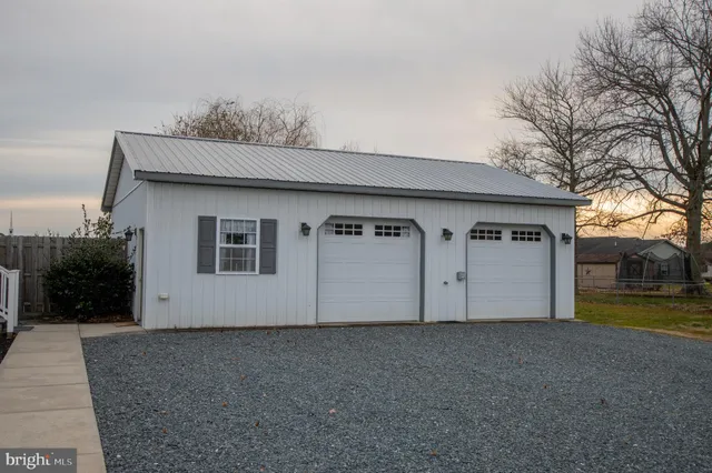 a view of garage and yard